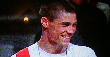 Swindon boxer Jamie Cox recieving his gold medal